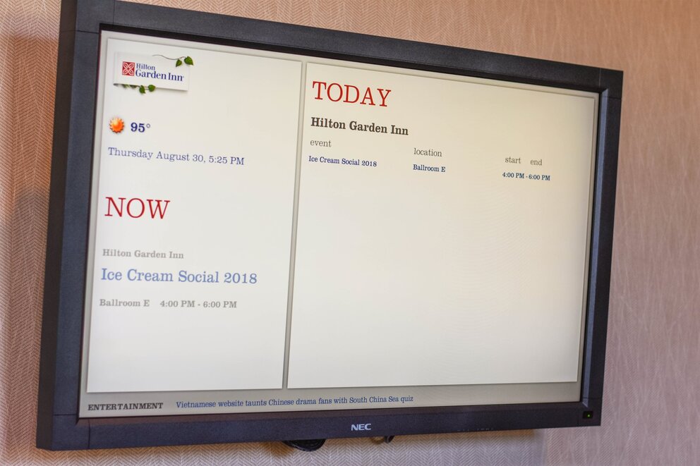 Tv on wall featuring an agenda at Texarkana Convention Center